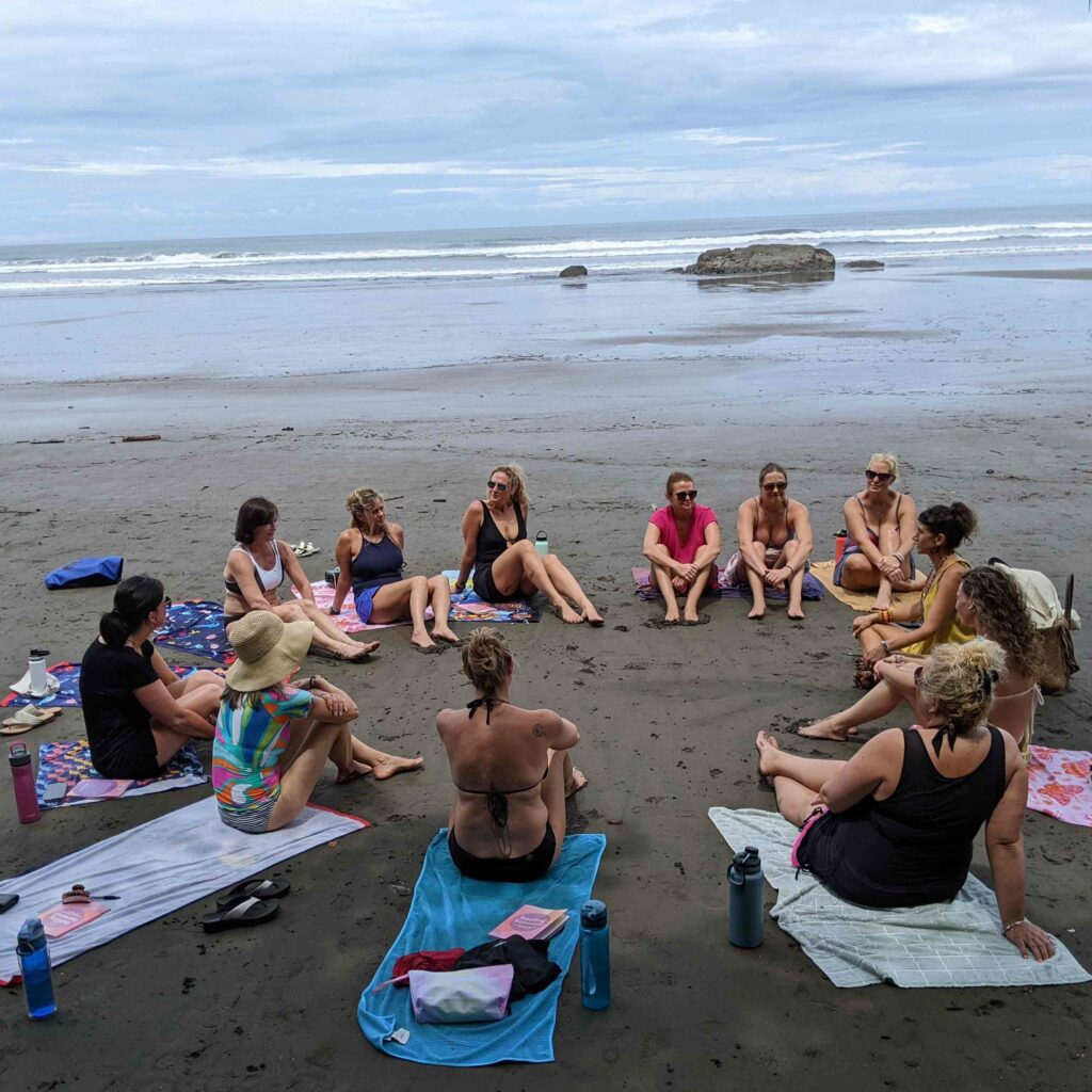 girls in circle on costa rica beach