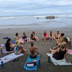 girls in circle on costa rica beach