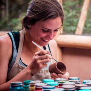 girl doing ceramics in peru